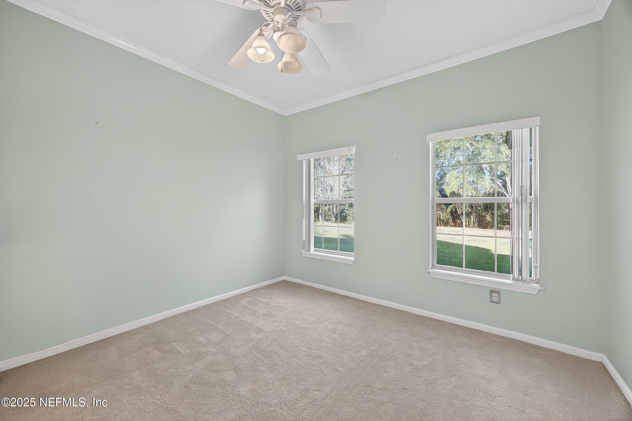 11319 Simmons Road Jacksonville, FL 32218 - Photo 19 of 32 a view of an empty room with a window