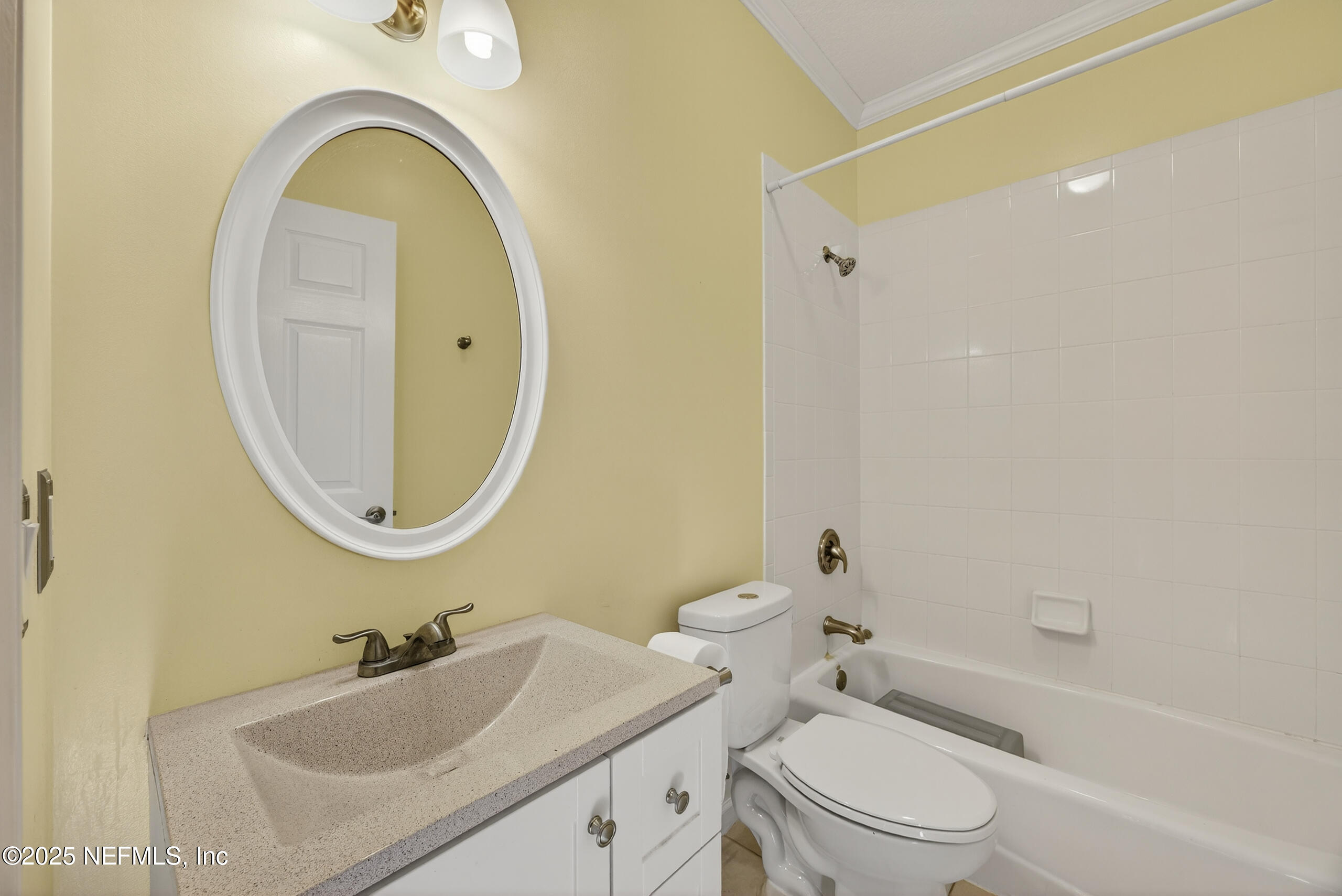 11319 Simmons Road Jacksonville, FL 32218 - Photo 21 of 32 a bathroom with a granite countertop sink mirror toilet and bathtub