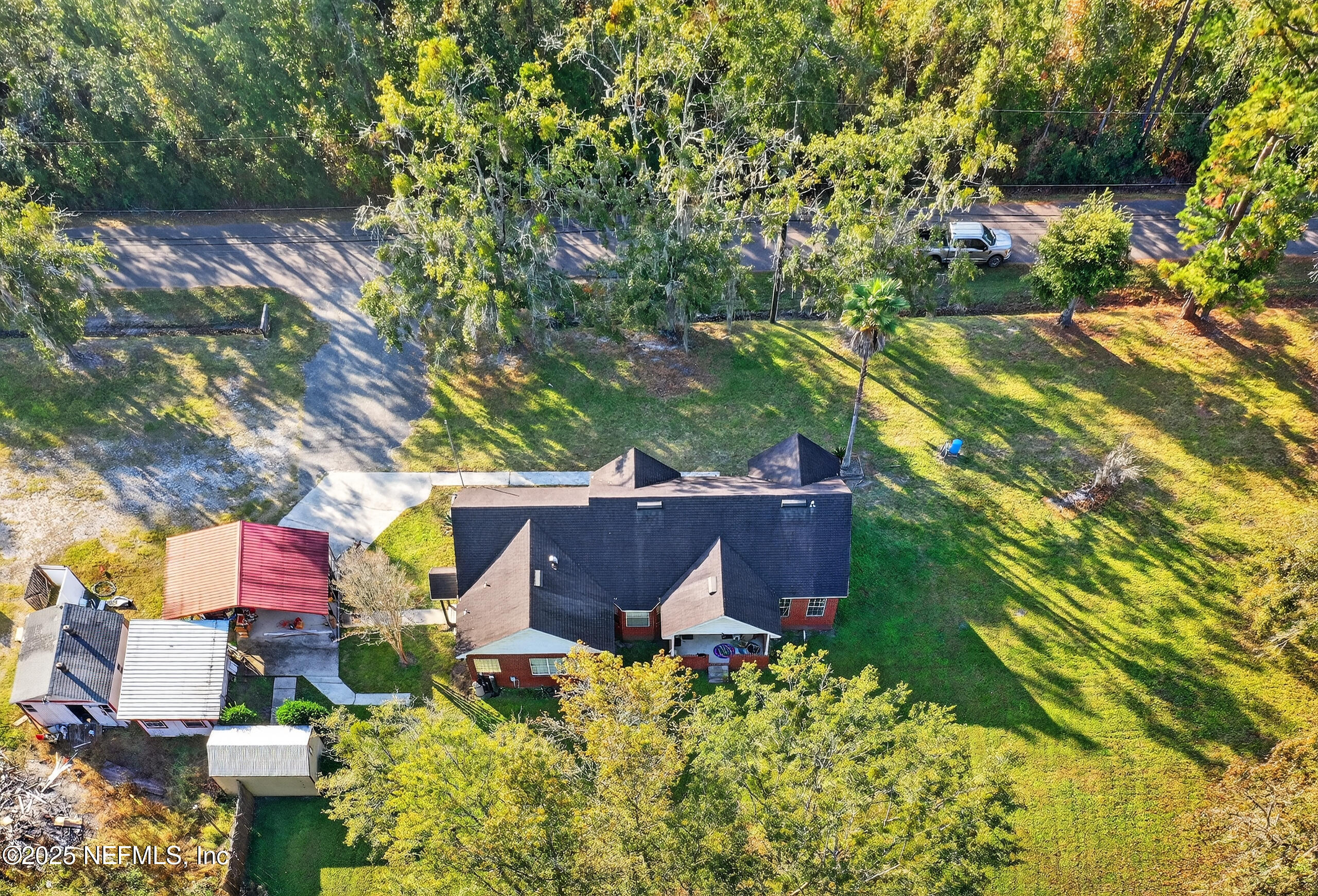 11319 Simmons Road Jacksonville, FL 32218 - Photo 27 of 32 an aerial view of house with yard swimming pool and outdoor seating