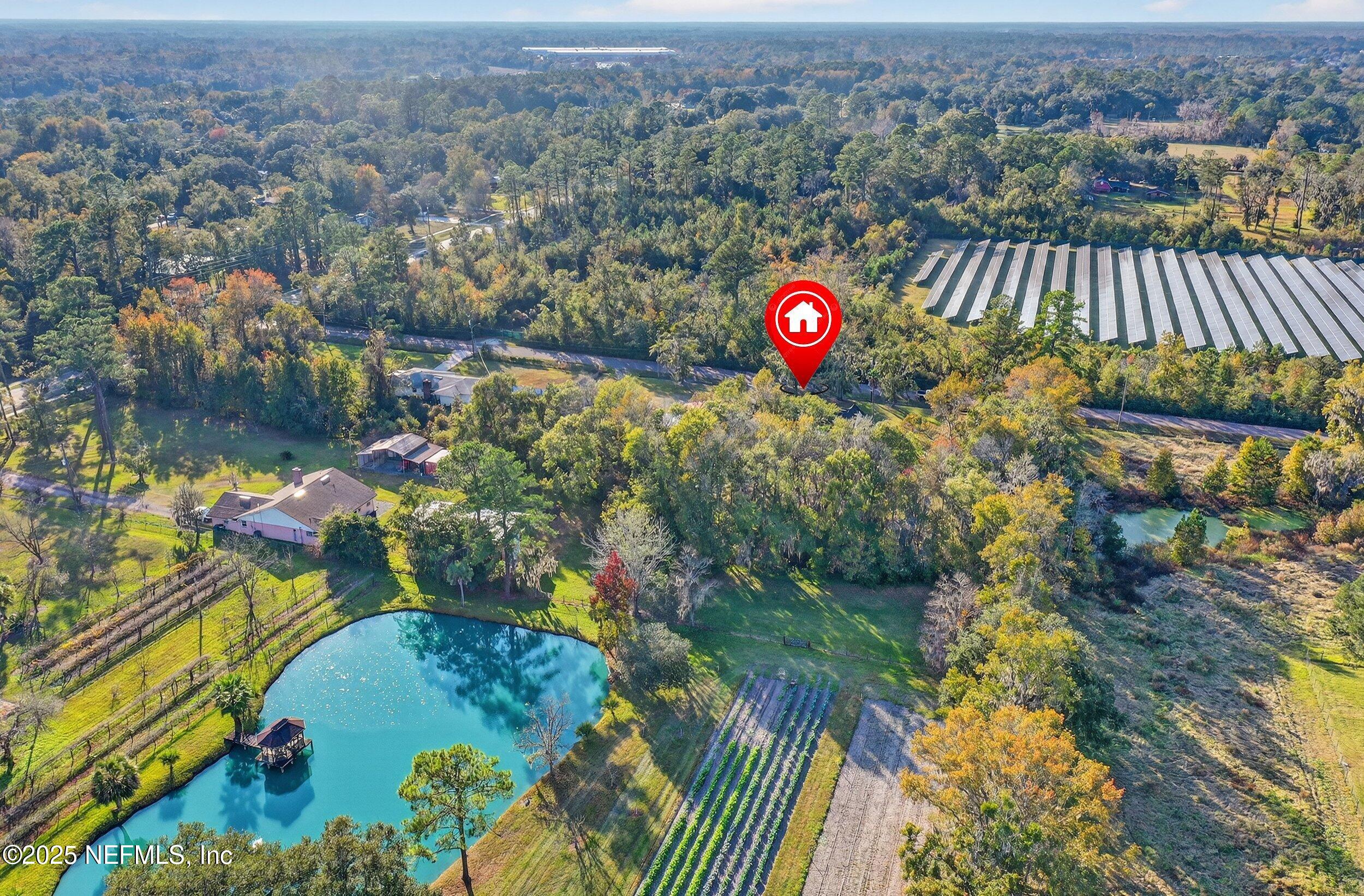 11319 Simmons Road Jacksonville, FL 32218 - Photo 30 of 32 an aerial view of a house with a lake view