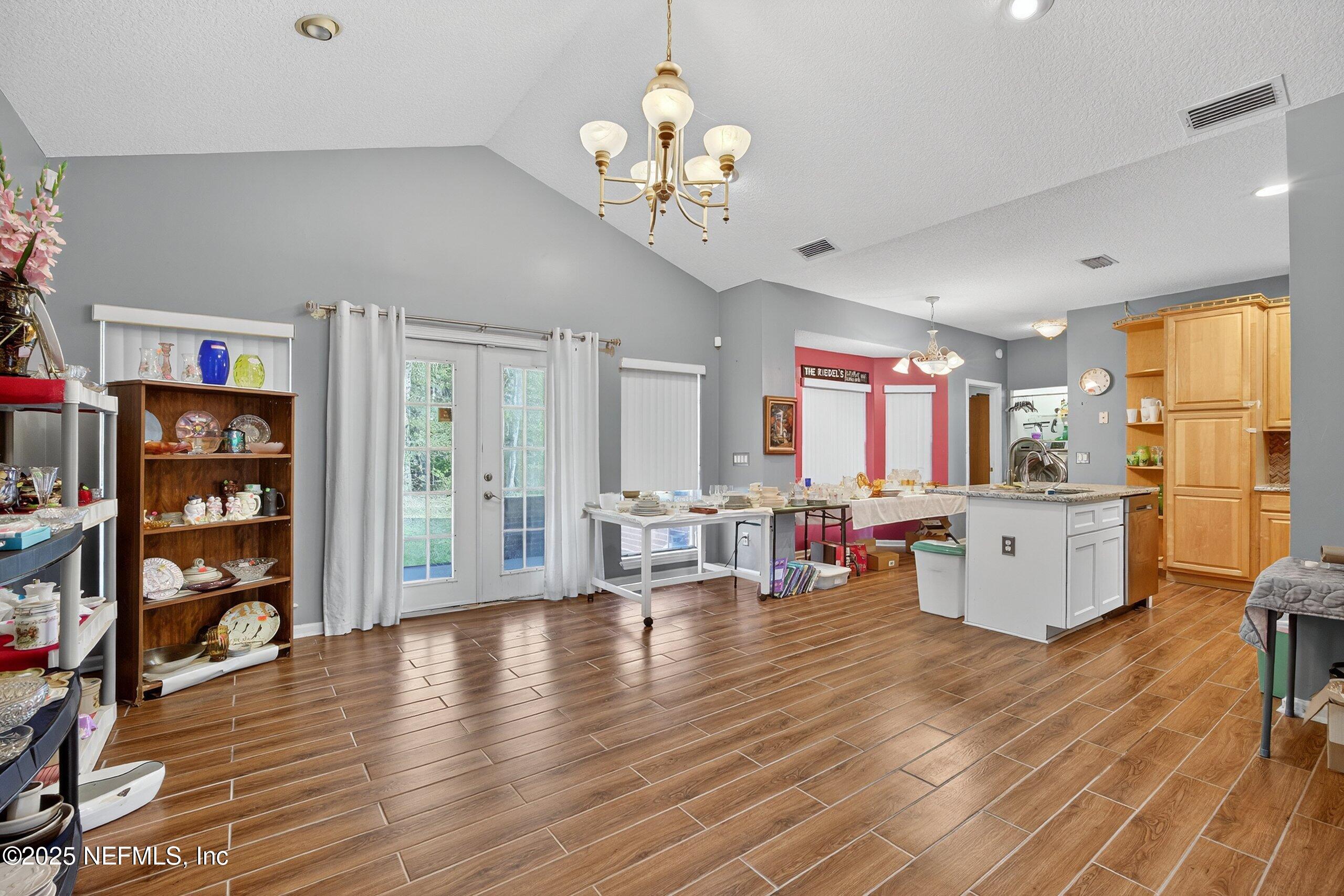 11319 Simmons Road Jacksonville, FL 32218 - Photo 3 of 32 a view of a dining room with furniture window and wooden floor