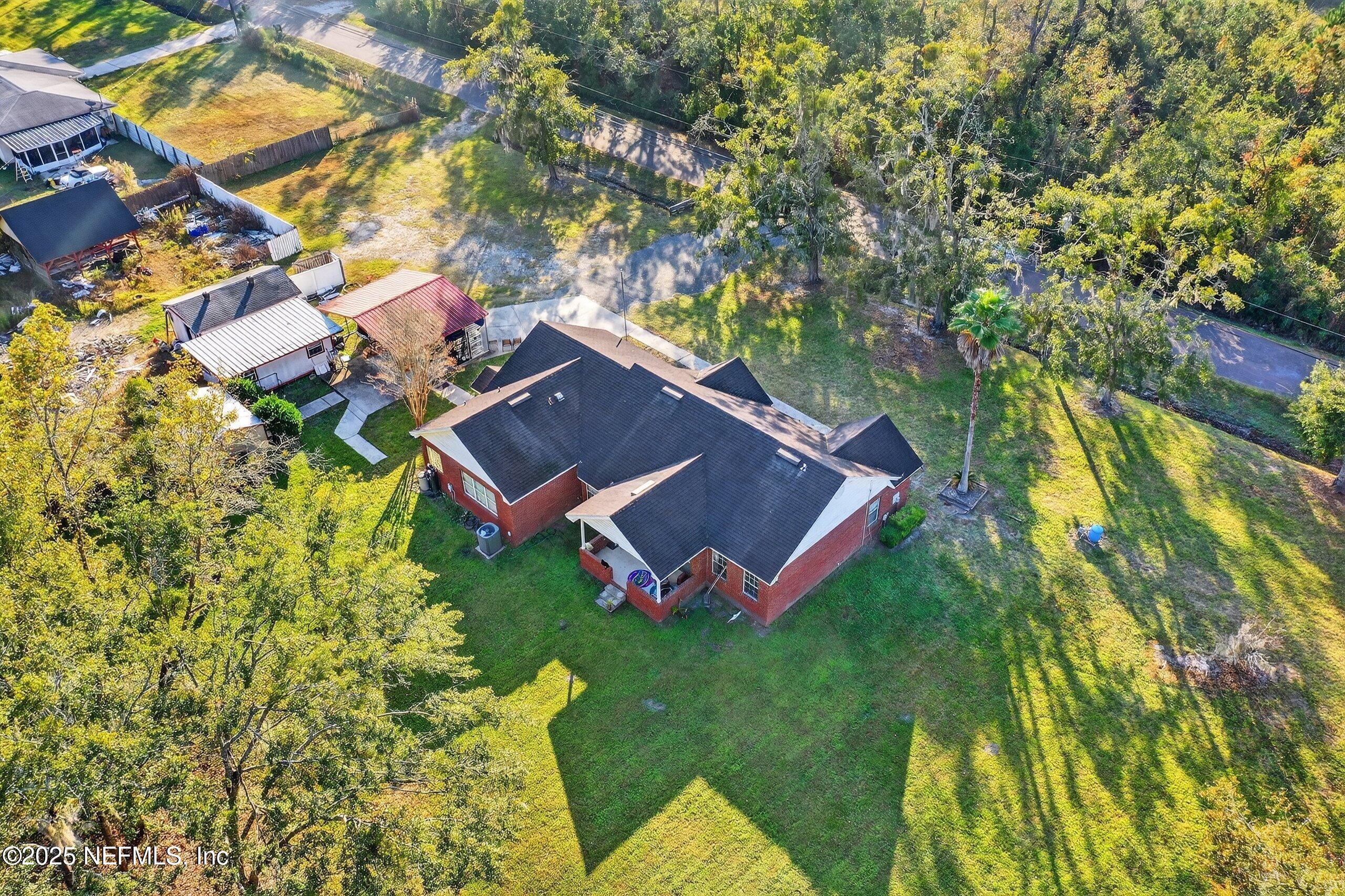 11319 Simmons Road Jacksonville, FL 32218 - Photo 5 of 32 a view of a house with a yard