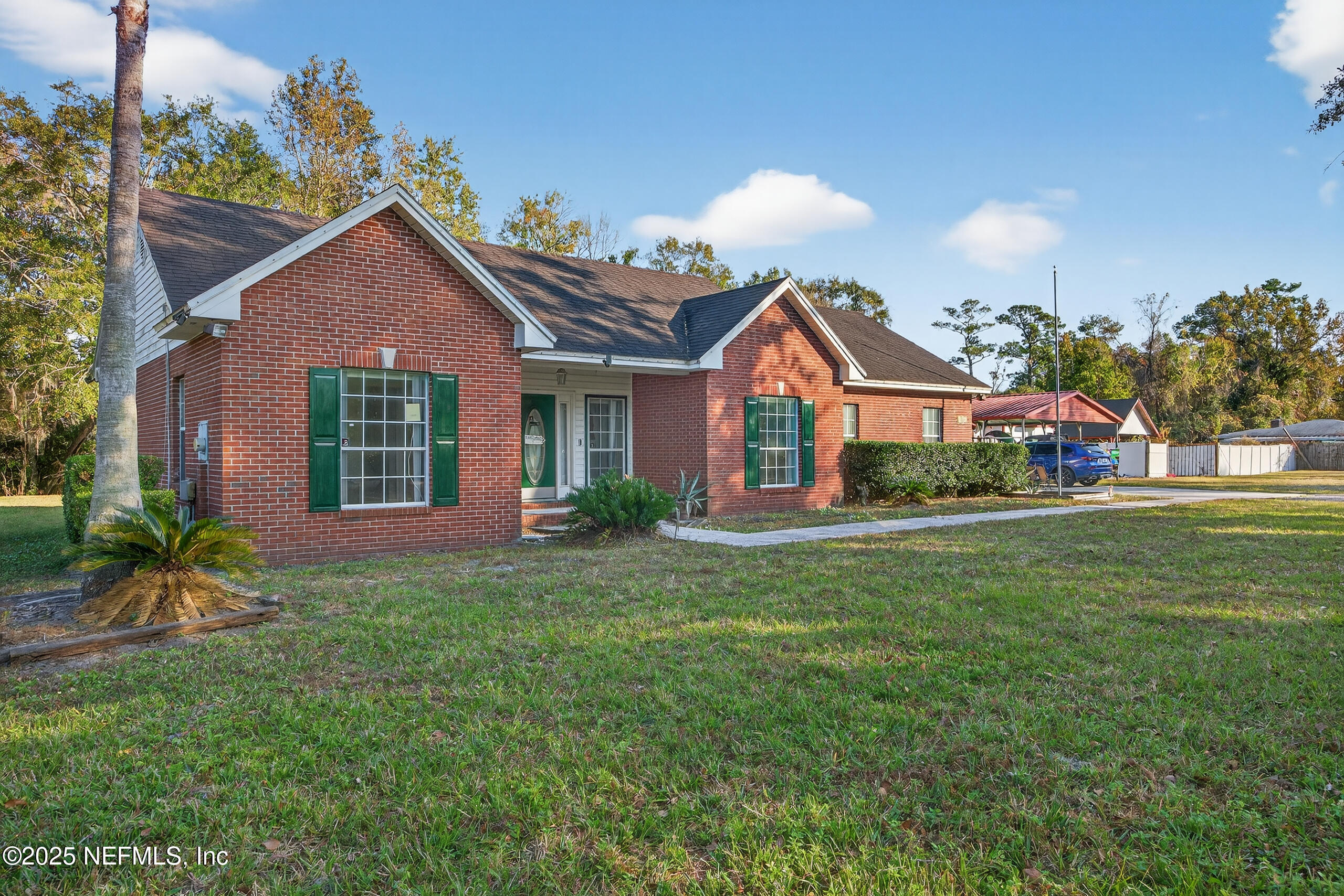11319 Simmons Road Jacksonville, FL 32218 - Photo 7 of 32 a front view of a house with a yard