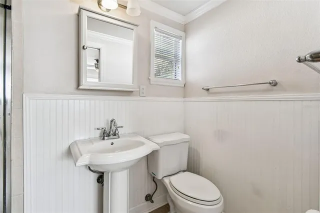 a bathroom with a sink a mirror and shower