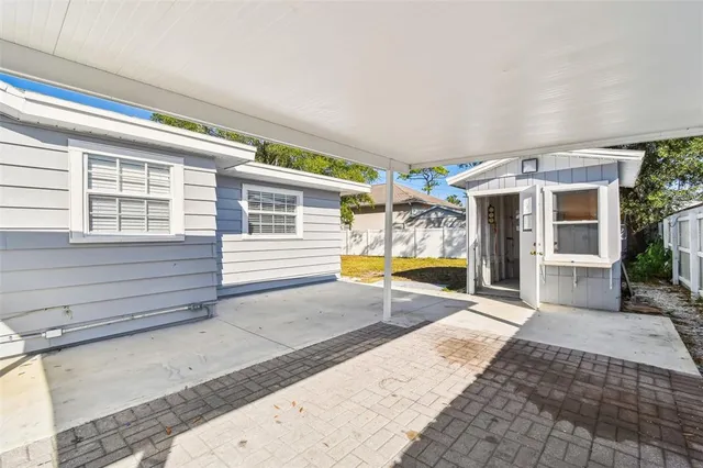 a view of a house with a yard and garage