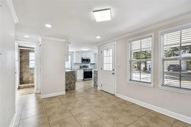 a view of a kitchen with kitchen island granite countertop living room