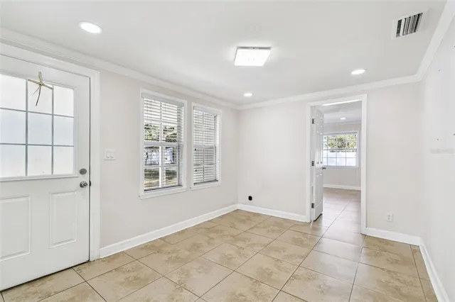 a view of an empty room with a window