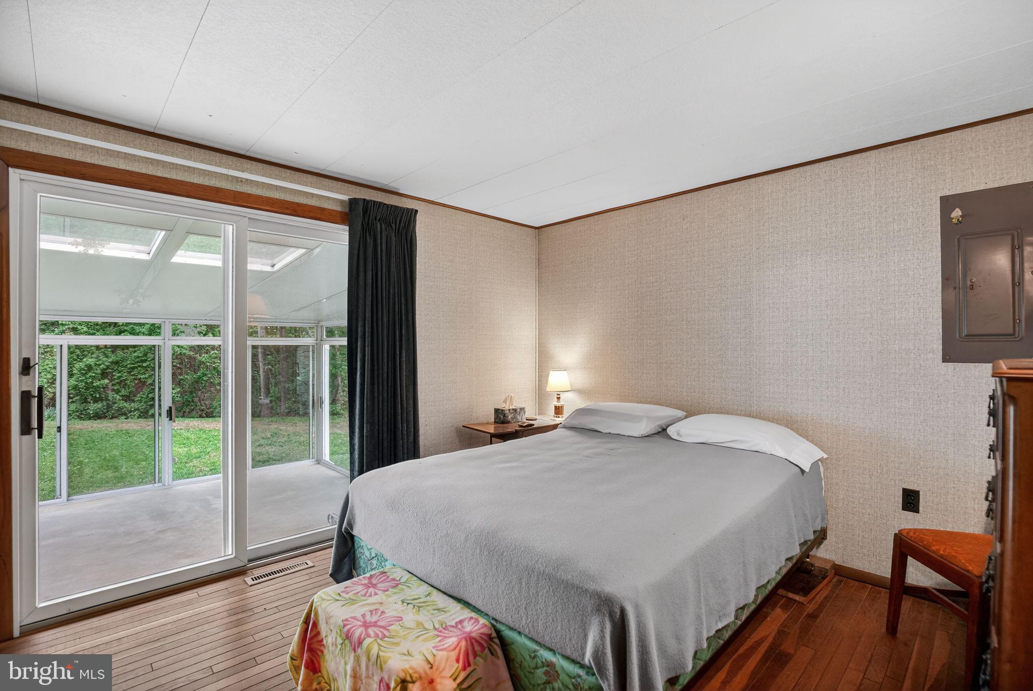 6070 Hill Road St. Leonard, MD 20685 - Photo 14 of 38 Primary Bedroom w/sliders to enclosed Patio