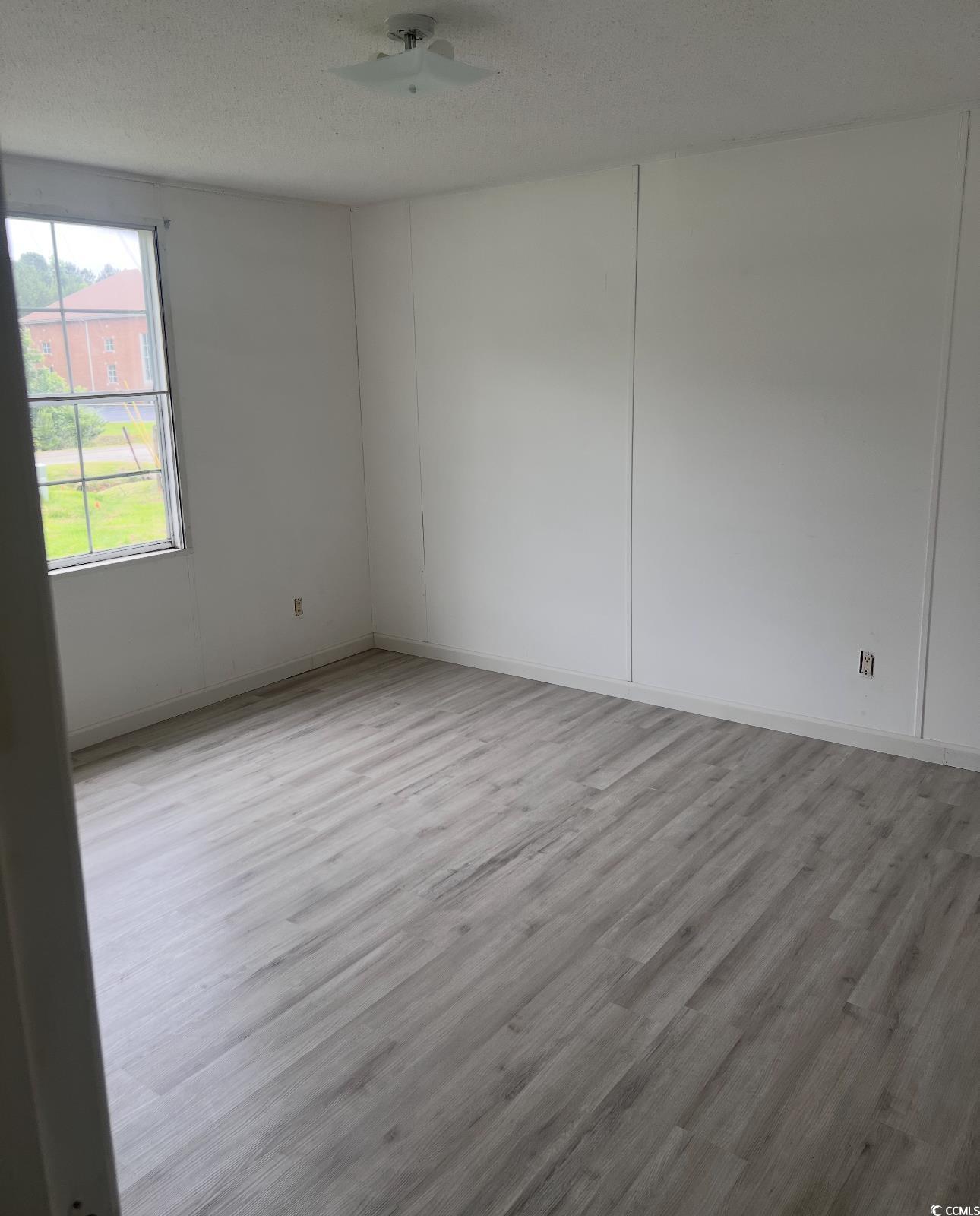 104 St Luke Church Road Winnsboro, SC 29180 - Photo 13 of 14 Unfurnished room with wood finished floors, ceilin