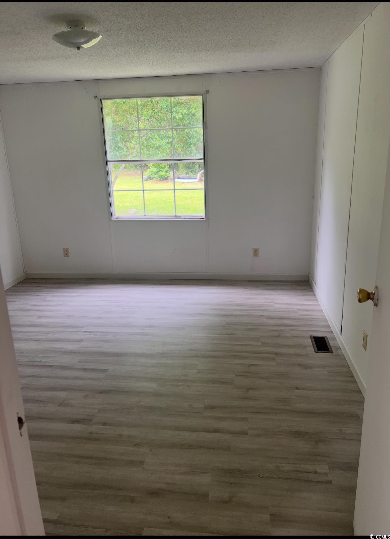 104 St Luke Church Road Winnsboro, SC 29180 - Photo 6 of 14 Unfurnished room featuring wood finished floors, b