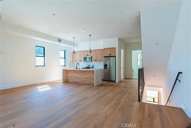 a view of kitchen with wooden floor