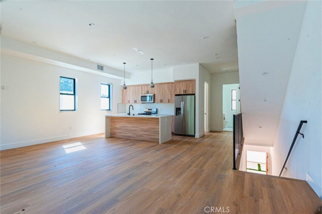 a view of kitchen with wooden floor