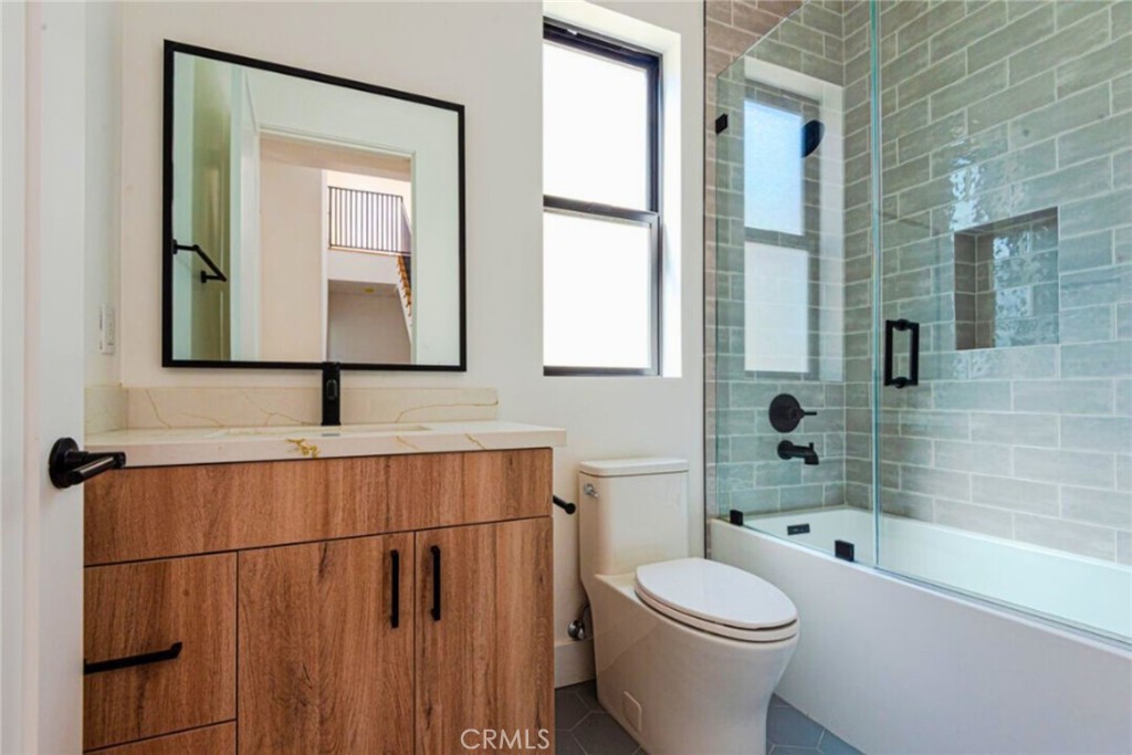 10847 Morrison Street North Hollywood, CA 91601 - Photo 11 of 13 a bathroom with a toilet a sink and shower