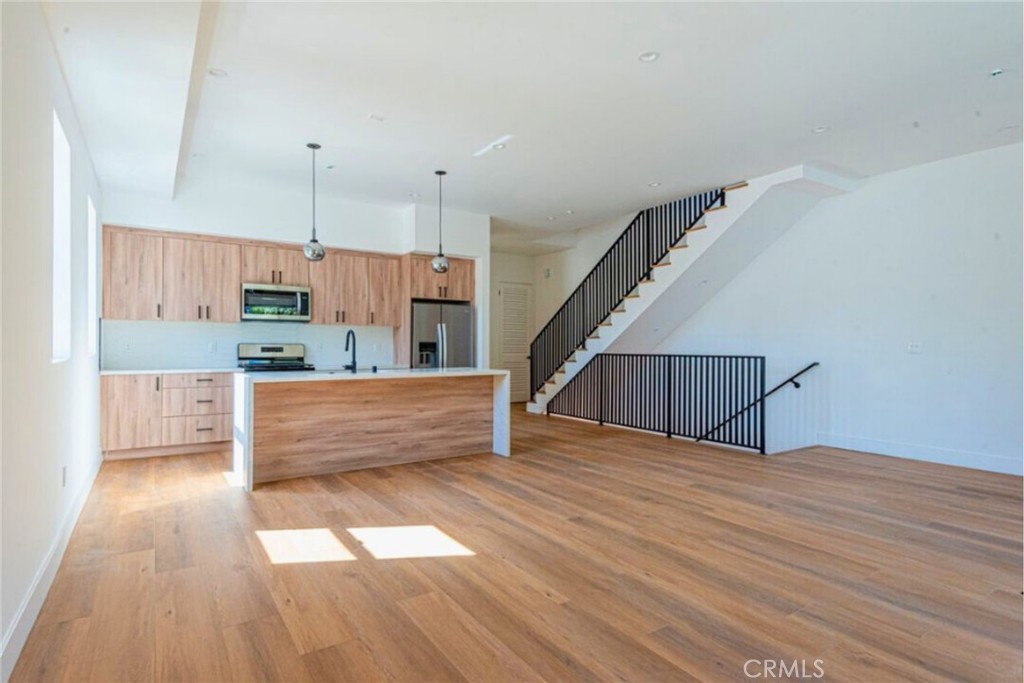 10847 Morrison Street North Hollywood, CA 91601 - Photo 2 of 13 a view of kitchen and kitchen with wooden floor