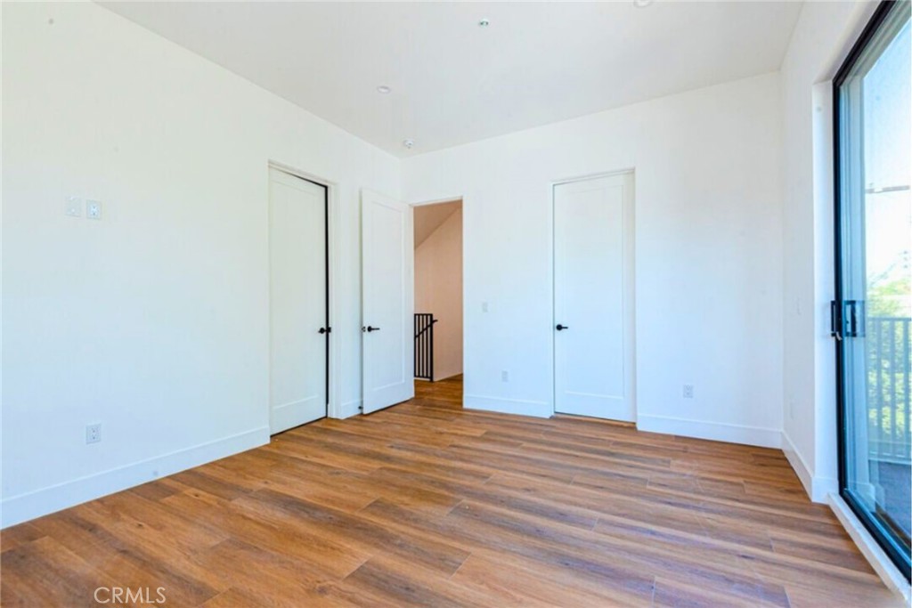 10847 Morrison Street North Hollywood, CA 91601 - Photo 6 of 13 a view of empty room with wooden floor