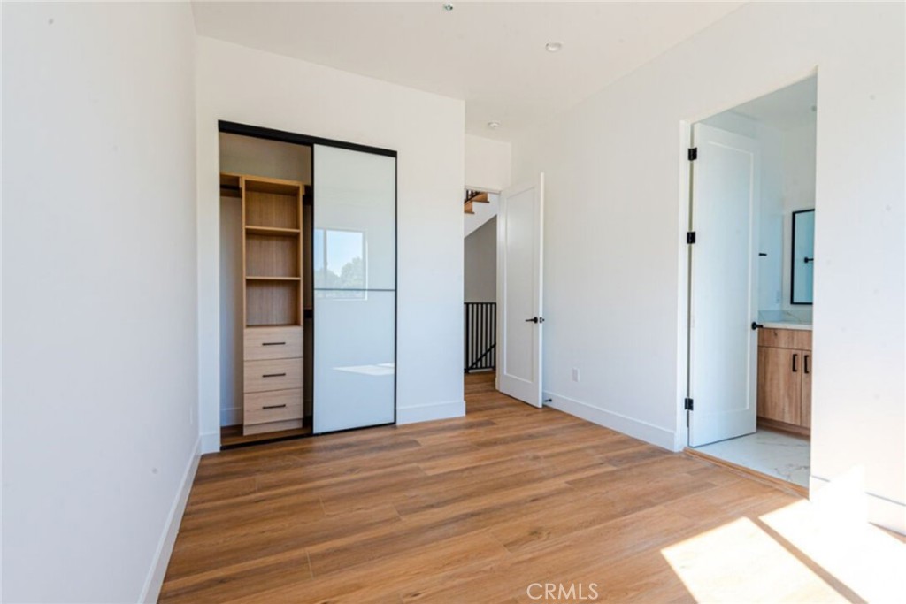 10847 Morrison Street North Hollywood, CA 91601 - Photo 8 of 13 a view of empty room with wooden floor and cabinet