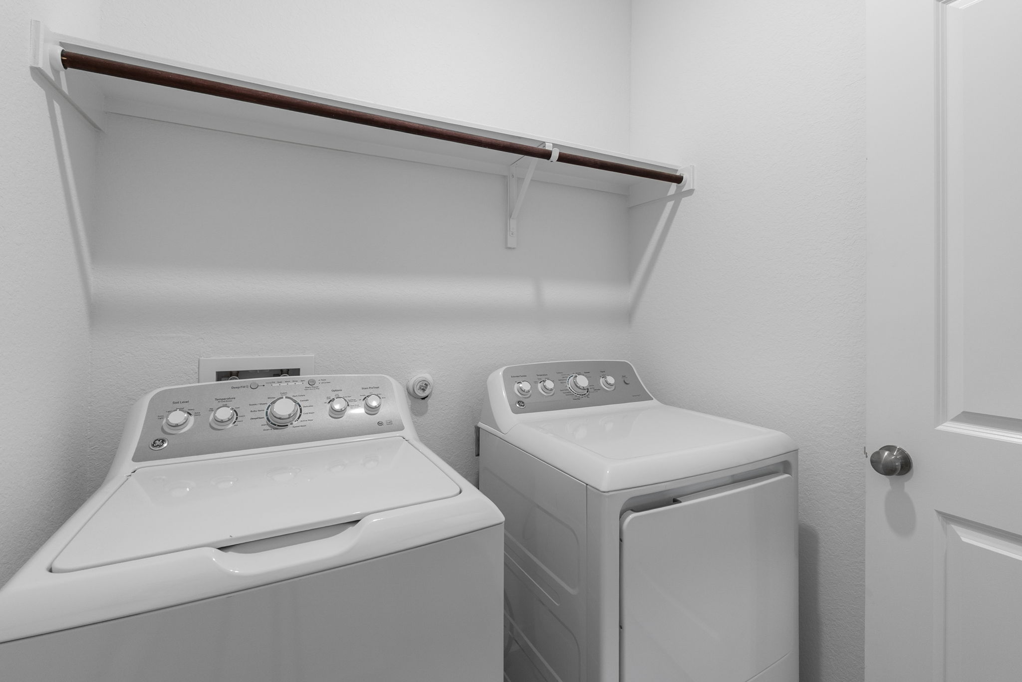 1240 Sweetspire Street Leander, TX 78641 - Photo 13 of 40 a utility room with dryer and washer