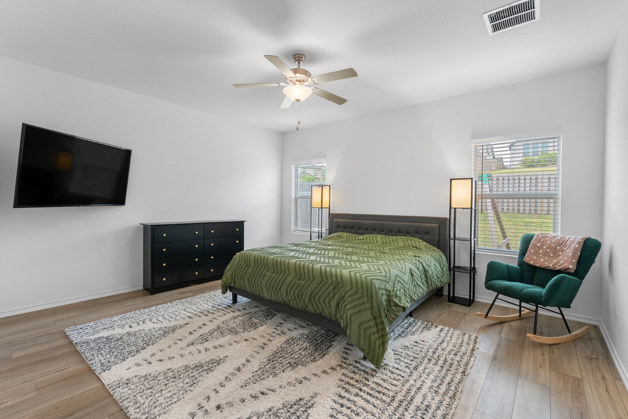1240 Sweetspire Street Leander, TX 78641 - Photo 14 of 40 a bedroom with a bed and a flat screen tv