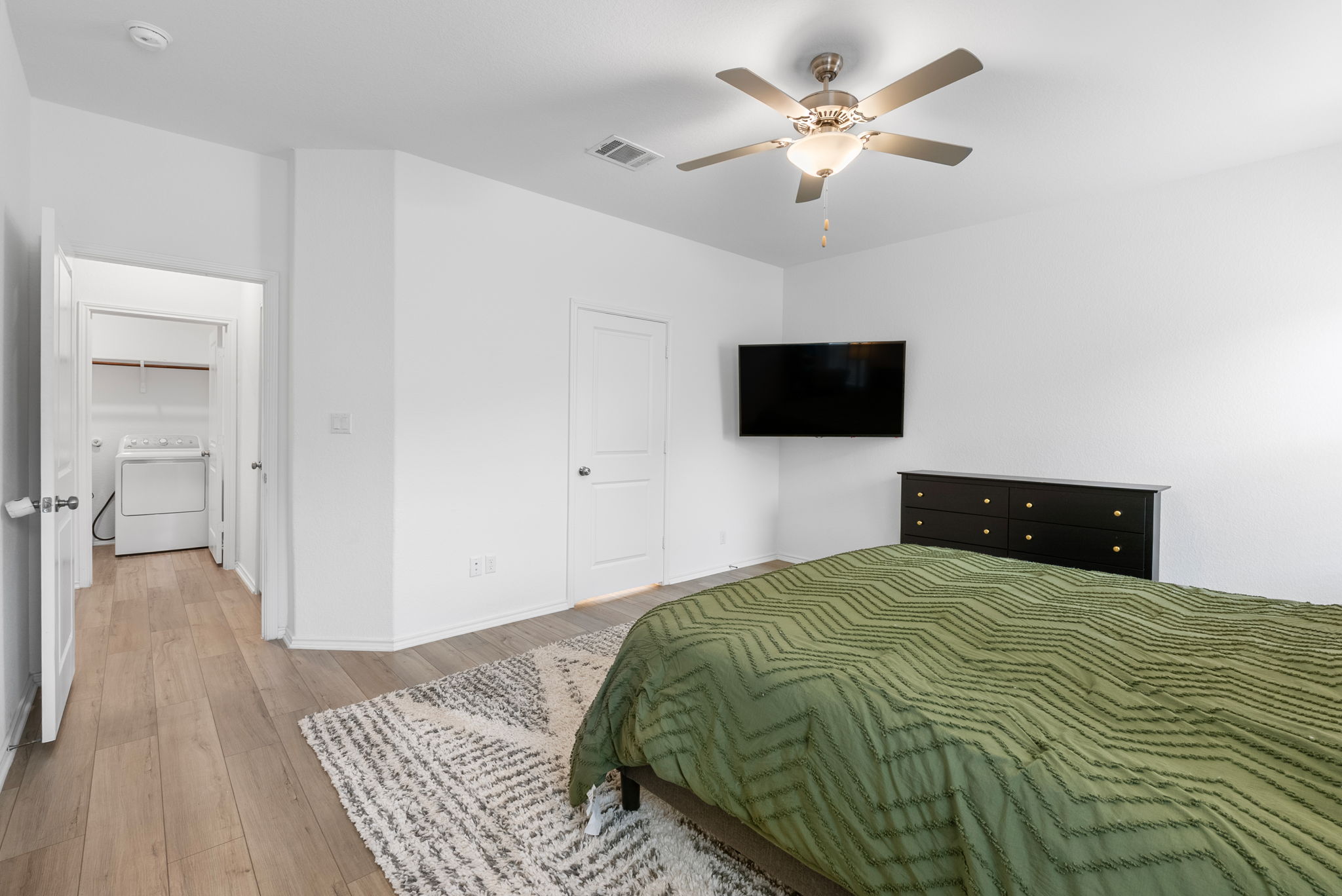 1240 Sweetspire Street Leander, TX 78641 - Photo 15 of 40 a bedroom with a bed and a flat screen tv