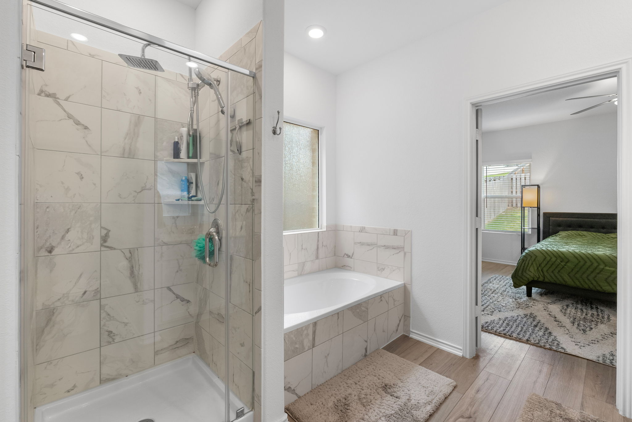 1240 Sweetspire Street Leander, TX 78641 - Photo 20 of 40 a bathroom with a tub shower and a sink