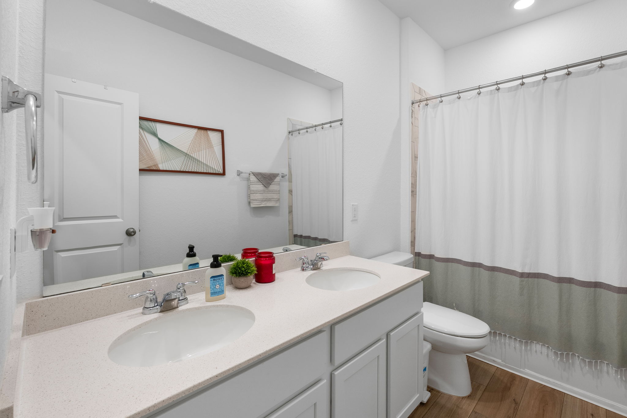 1240 Sweetspire Street Leander, TX 78641 - Photo 24 of 40 a bathroom with a sink vanity granite and toilet