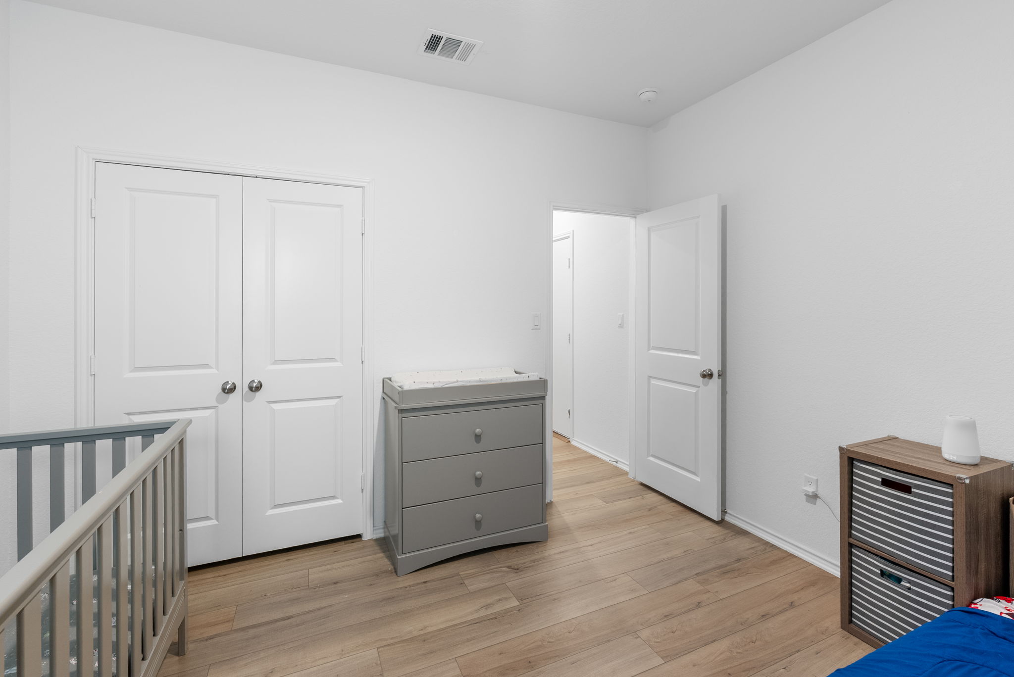 1240 Sweetspire Street Leander, TX 78641 - Photo 26 of 40 a view of room with wooden floor