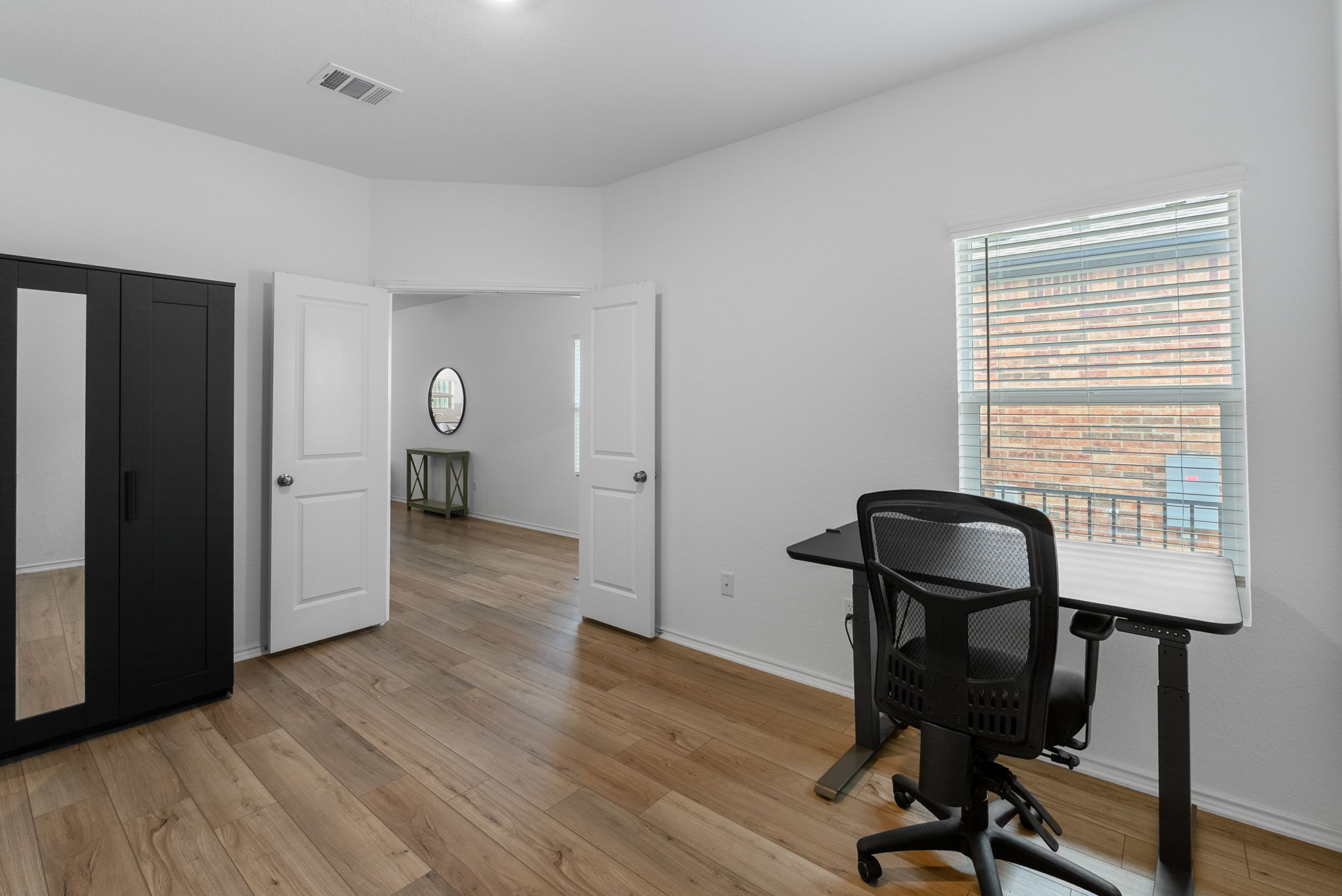 1240 Sweetspire Street Leander, TX 78641 - Photo 30 of 40 a view of a workspace with furniture and a window