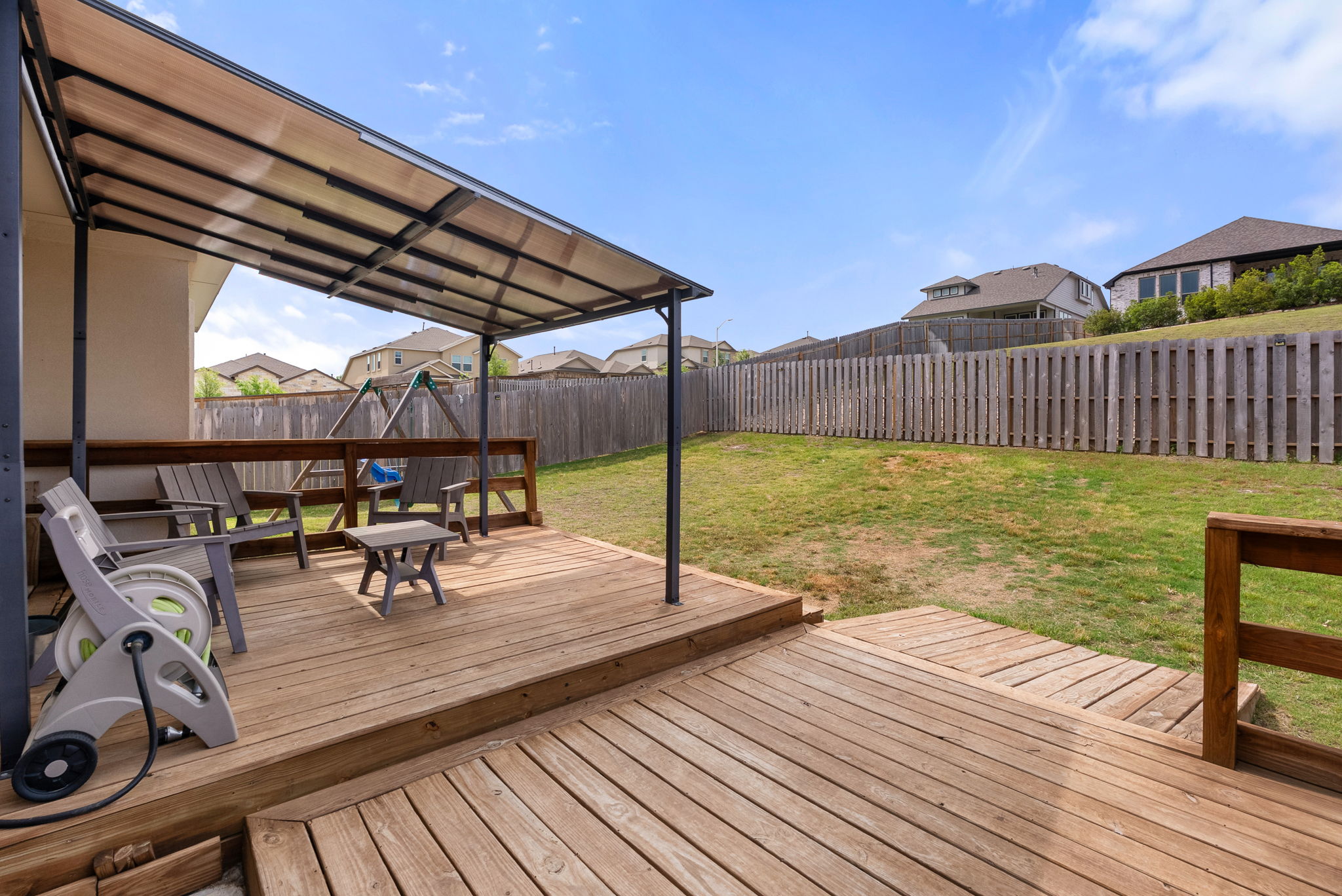 1240 Sweetspire Street Leander, TX 78641 - Photo 31 of 40 a view of a roof deck with chair and wooden floor