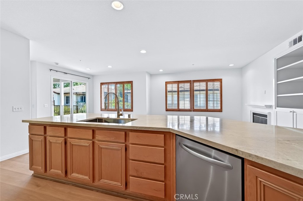 447 Ridgeway Irvine, CA 92620 - Photo 70 of 88 a kitchen with lots of counter top space and windows
