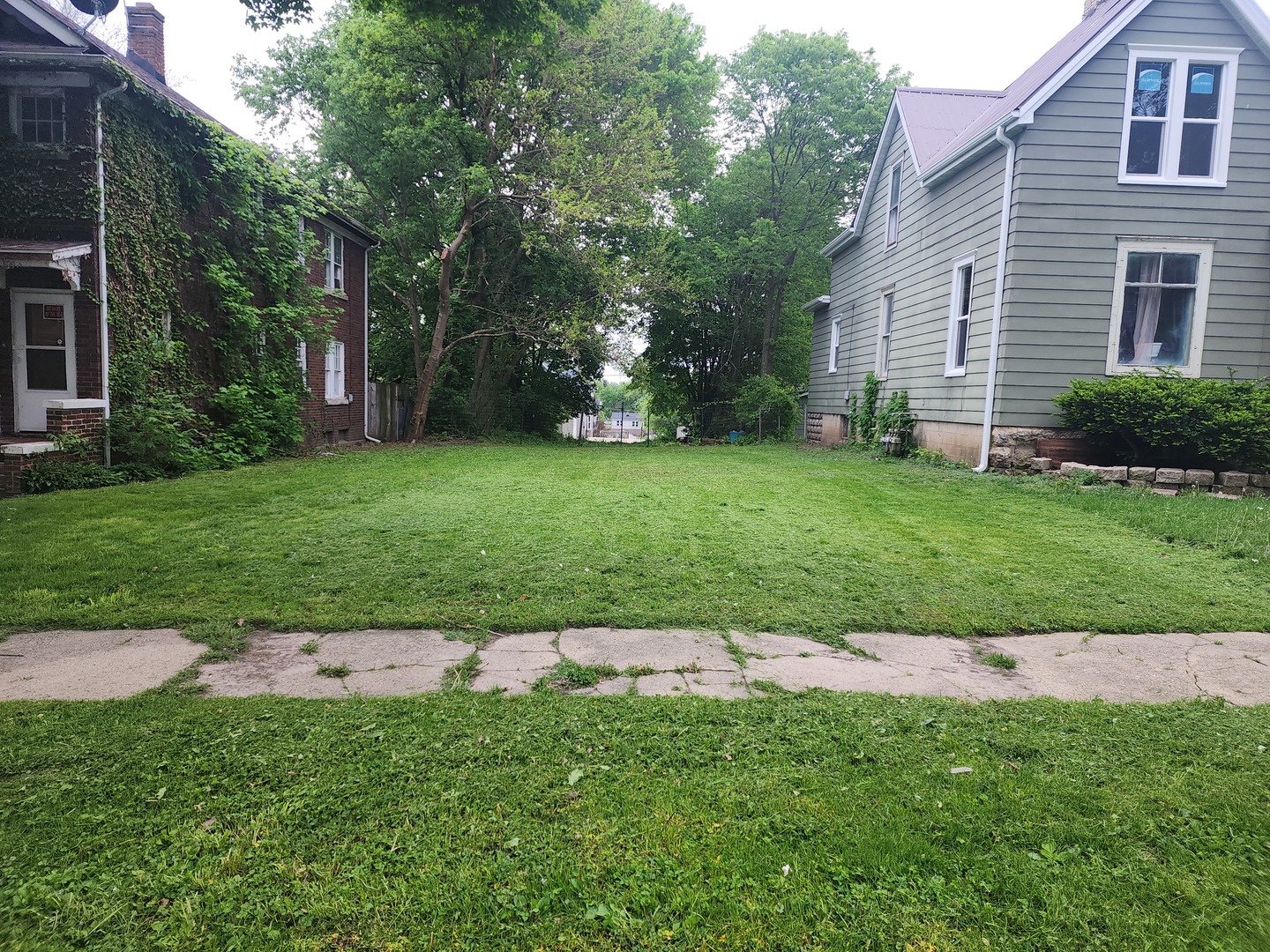 a backyard of a house with lots of green space