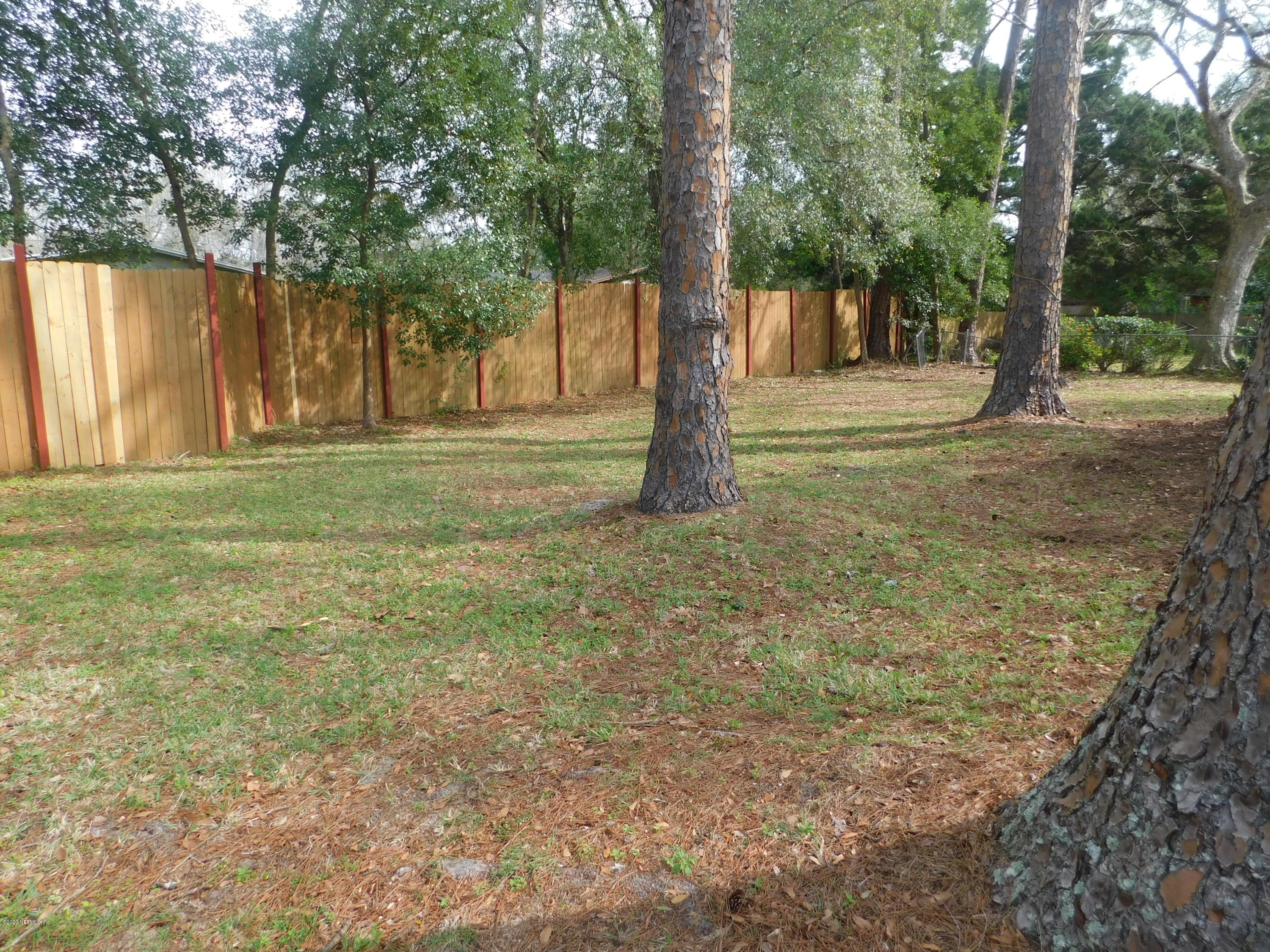7413 Proxima Road Jacksonville, FL 32210 - Photo 20 of 24 a view of outdoor space with trees