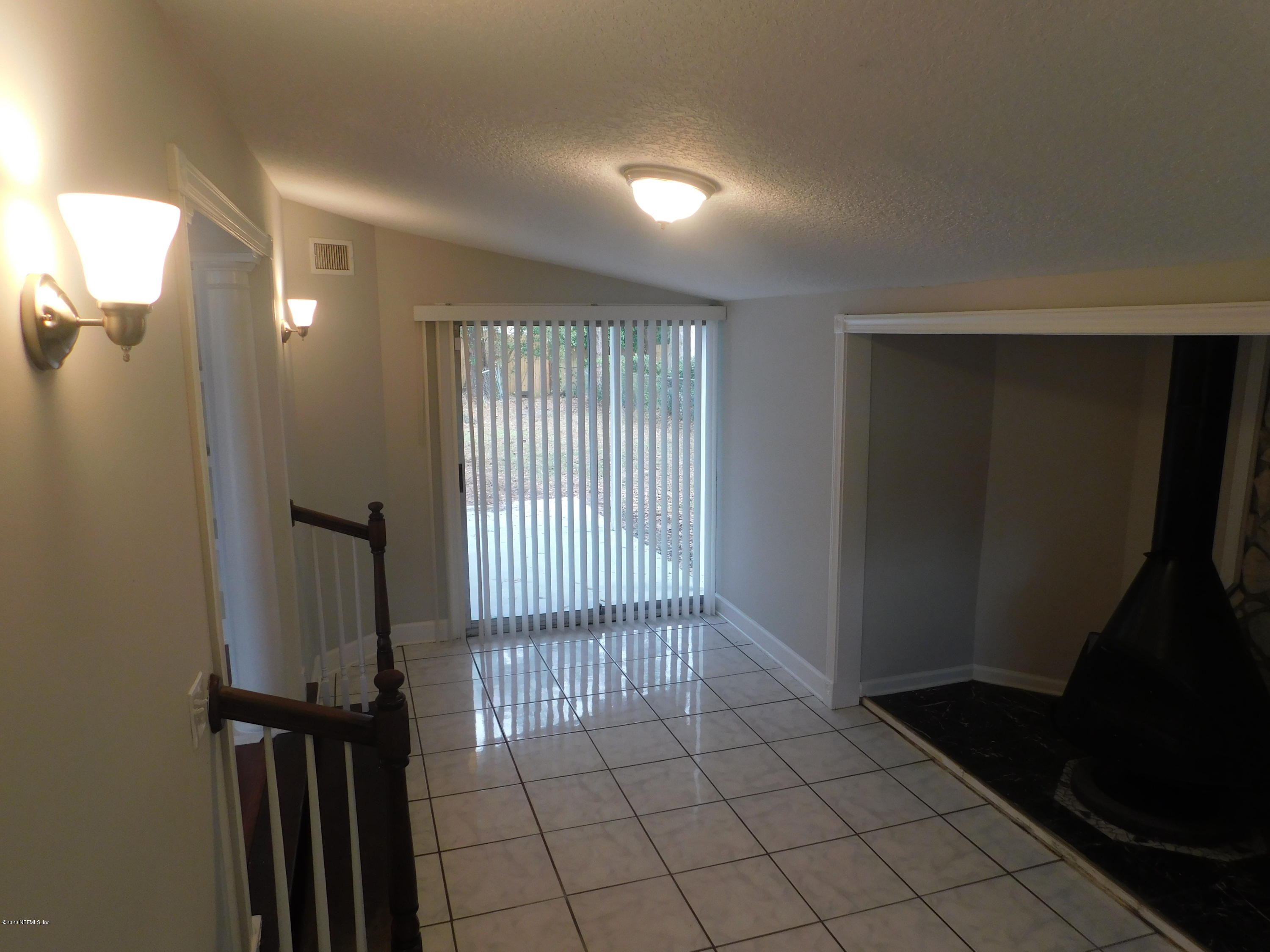 7413 Proxima Road Jacksonville, FL 32210 - Photo 8 of 24 a view of a hallway with windows