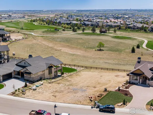 an aerial view of a house with a lake view