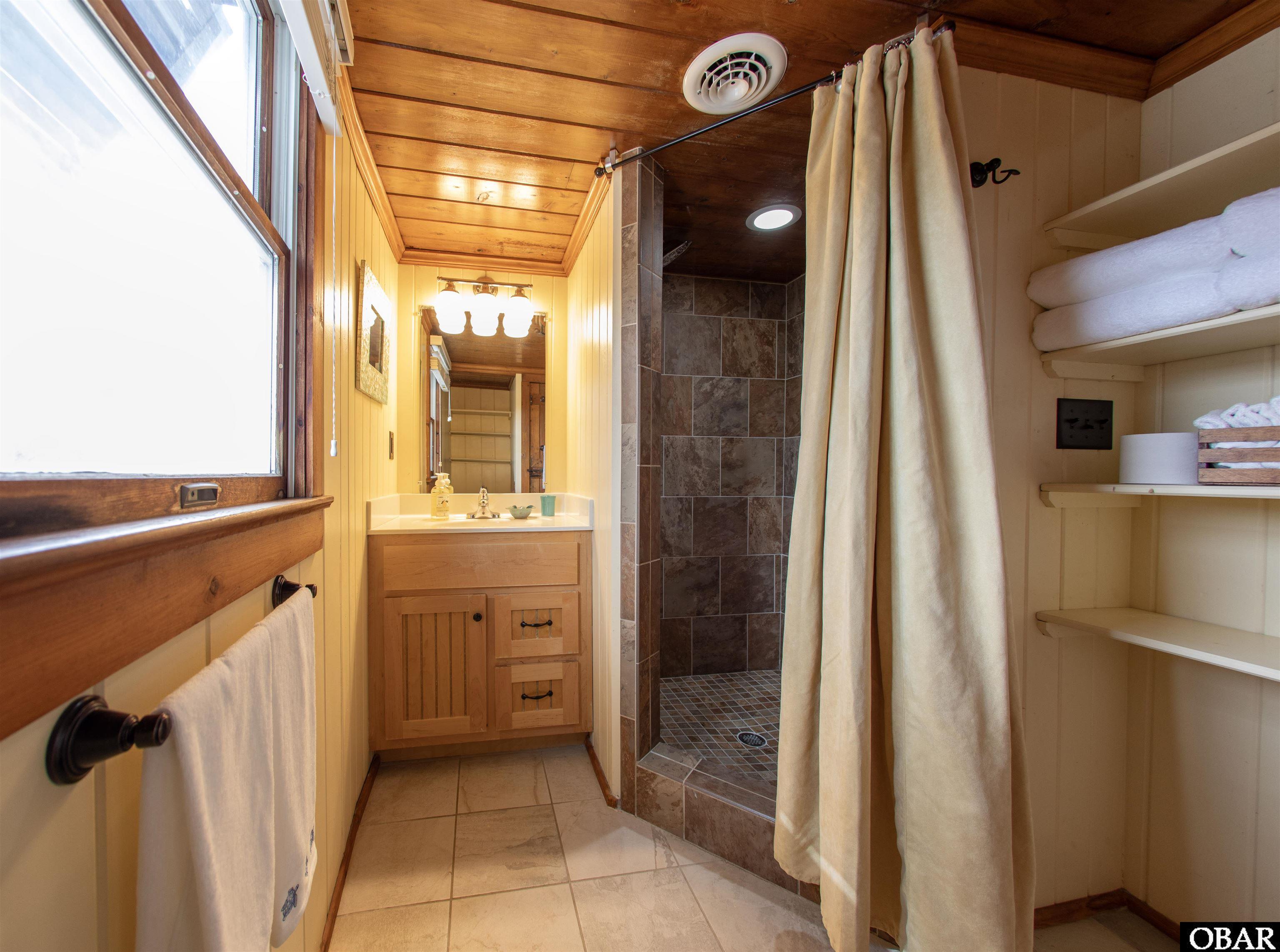 41 Skyline Road, Unit 1 Southern Shores, NC 27949 - Photo 24 of 58 Bathroom with tiled shower.