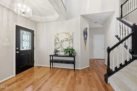 a view of entryway with wooden floor and stairs