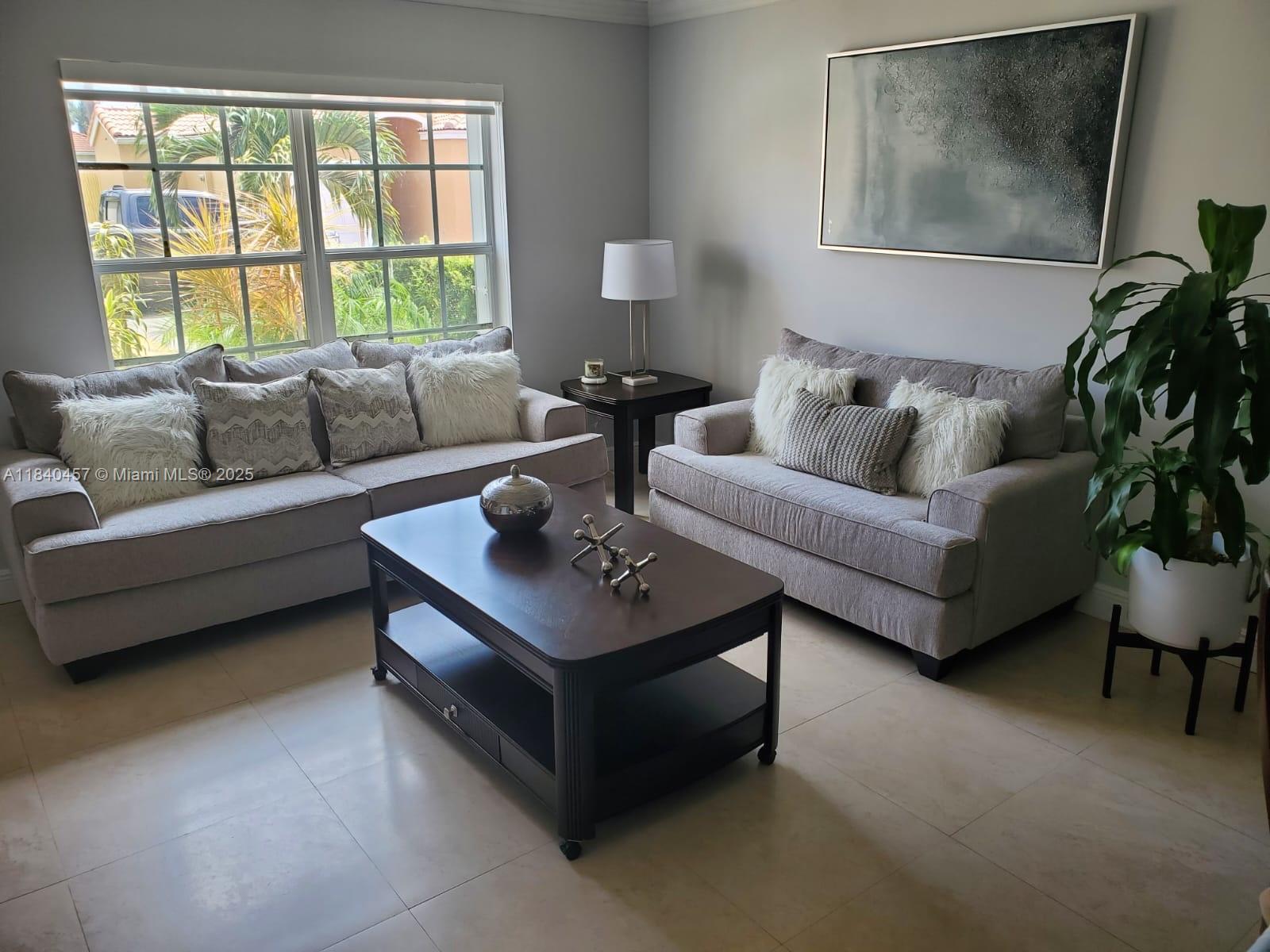 9982 Southwest 162nd Court Miami, FL 33196 - Photo 11 of 97 a living room with furniture and a window