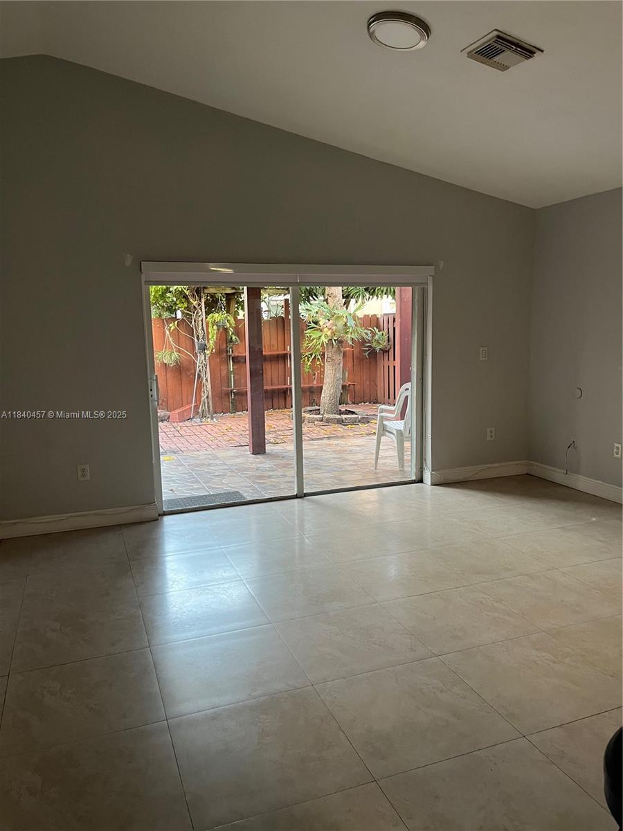 9982 Southwest 162nd Court Miami, FL 33196 - Photo 20 of 97 an empty room with windows