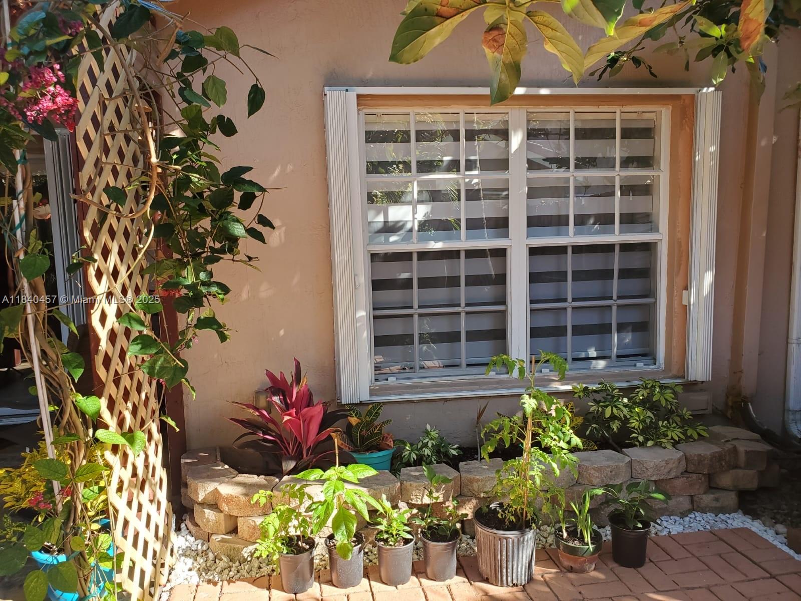 9982 Southwest 162nd Court Miami, FL 33196 - Photo 77 of 97 a front view of a house