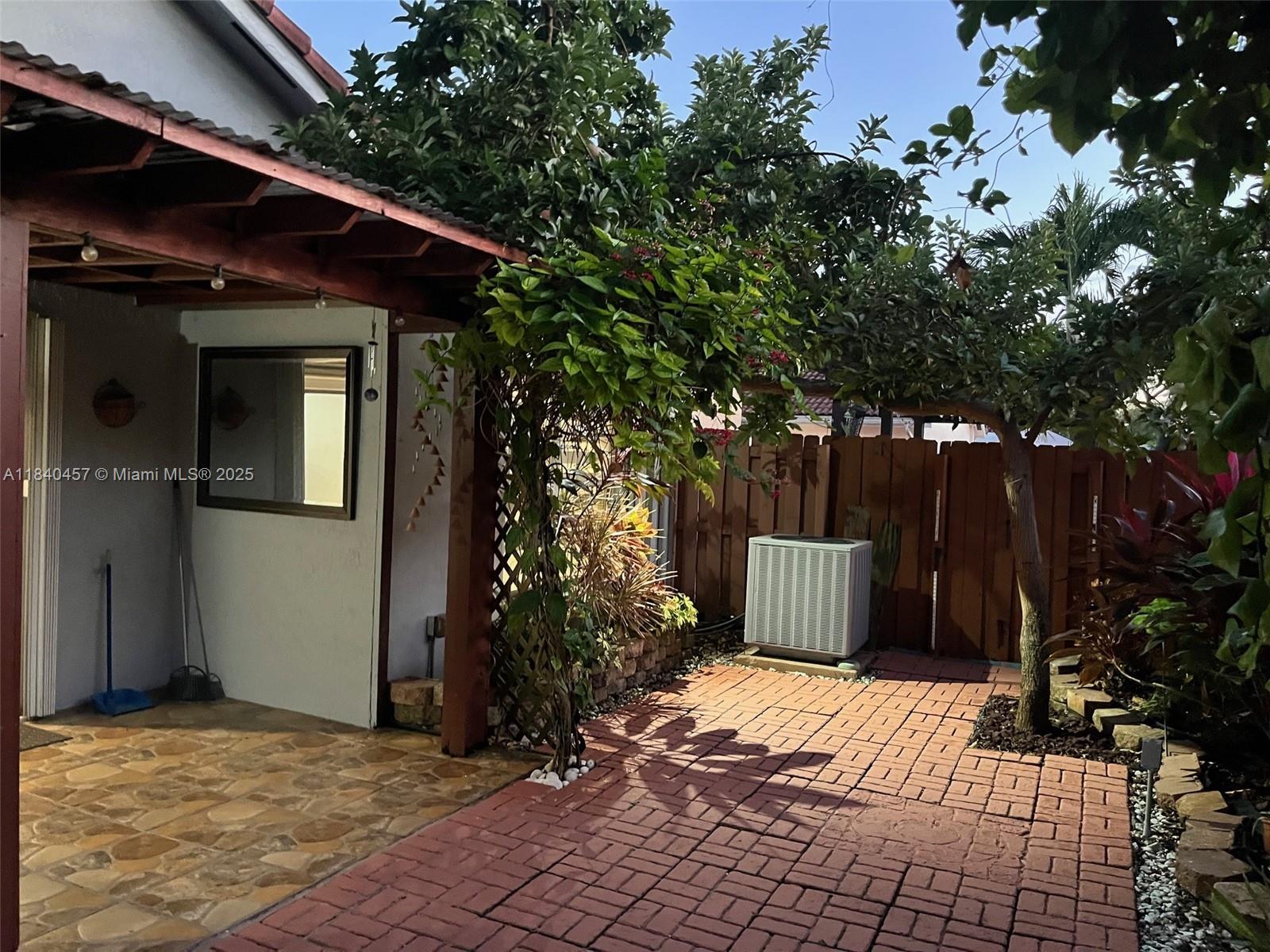 9982 Southwest 162nd Court Miami, FL 33196 - Photo 91 of 97 a view of a house with a yard