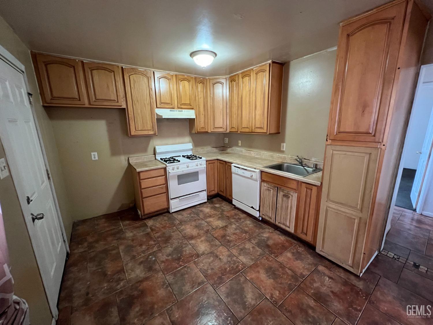 Undisclosed Address Bakersfield, CA 93306 - Photo 12 of 33 a kitchen with stainless steel appliances granite countertop a refrigerator sink and cabinets