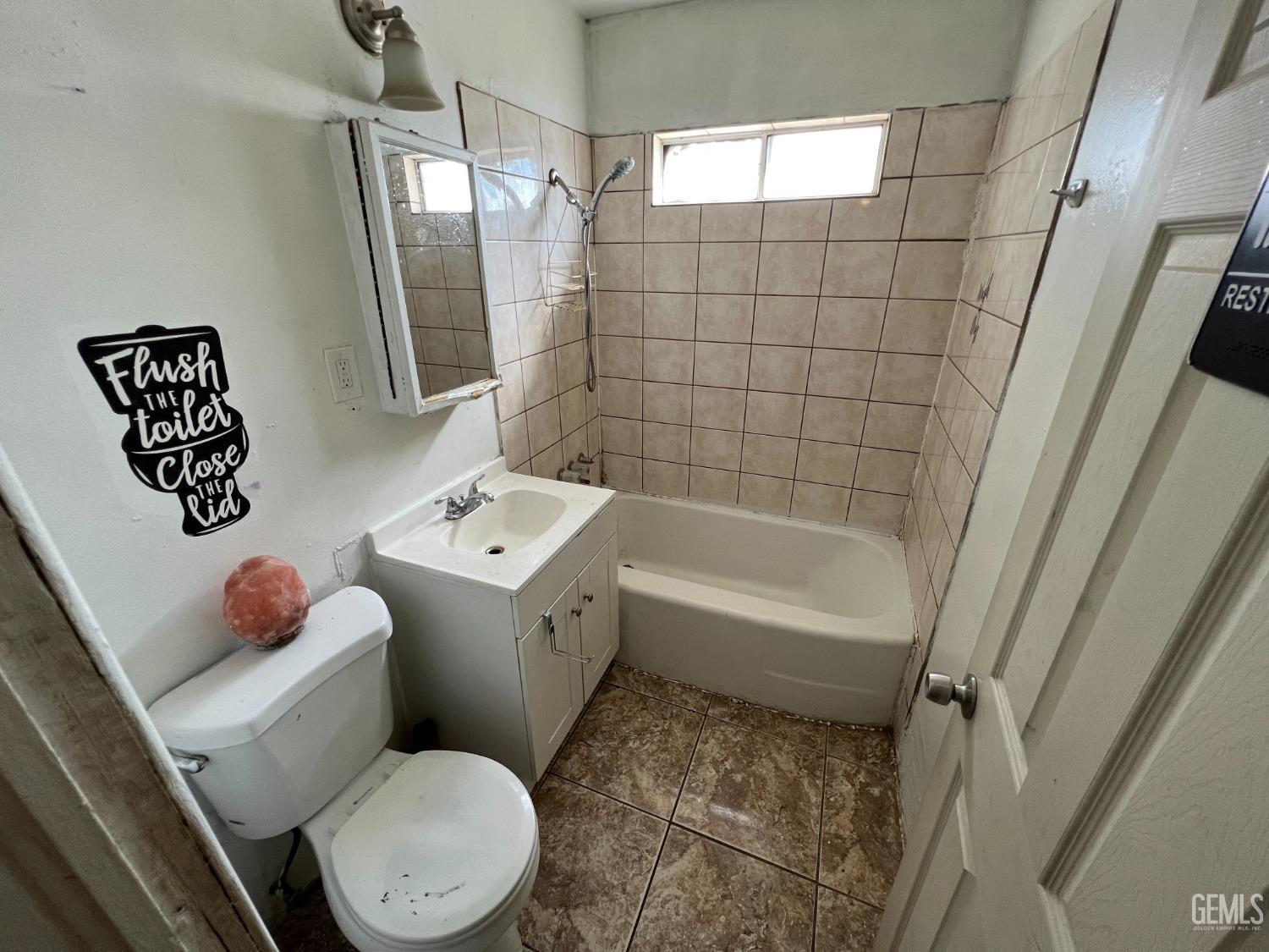 Undisclosed Address Bakersfield, CA 93306 - Photo 14 of 33 a bathroom with a toilet sink and shower