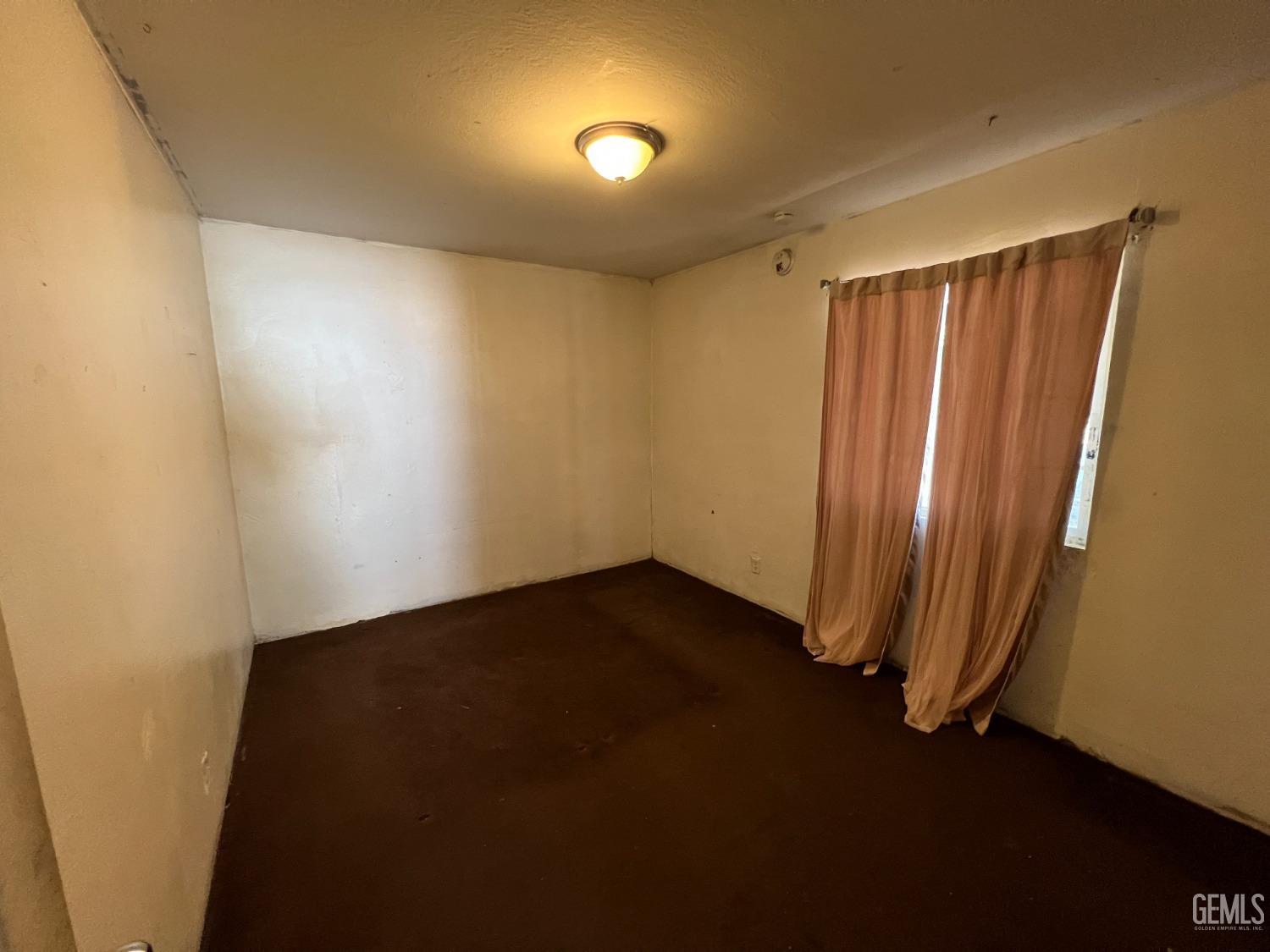 Undisclosed Address Bakersfield, CA 93306 - Photo 19 of 33 an empty room with a door