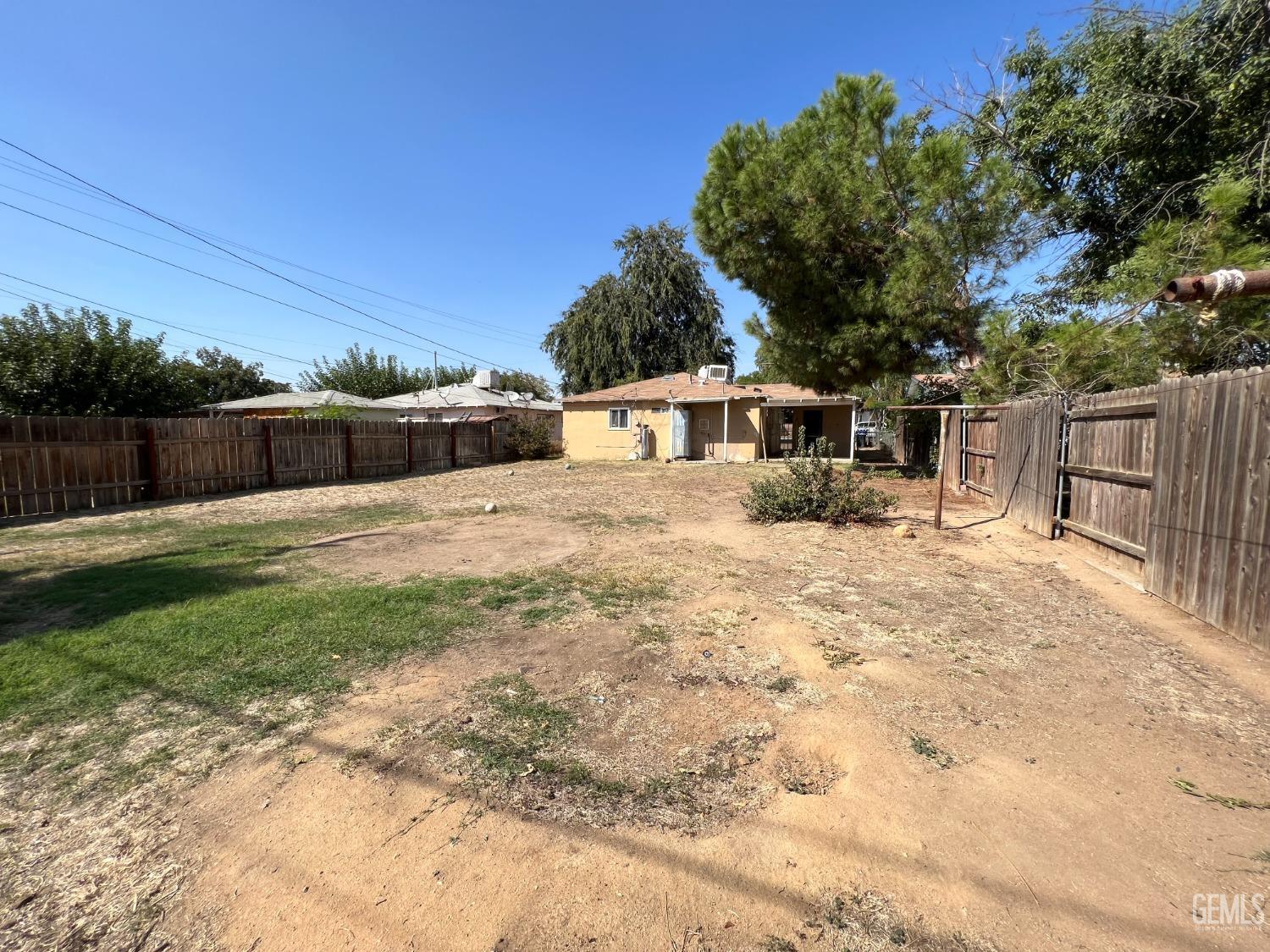Undisclosed Address Bakersfield, CA 93306 - Photo 23 of 33 a view of house with a yard