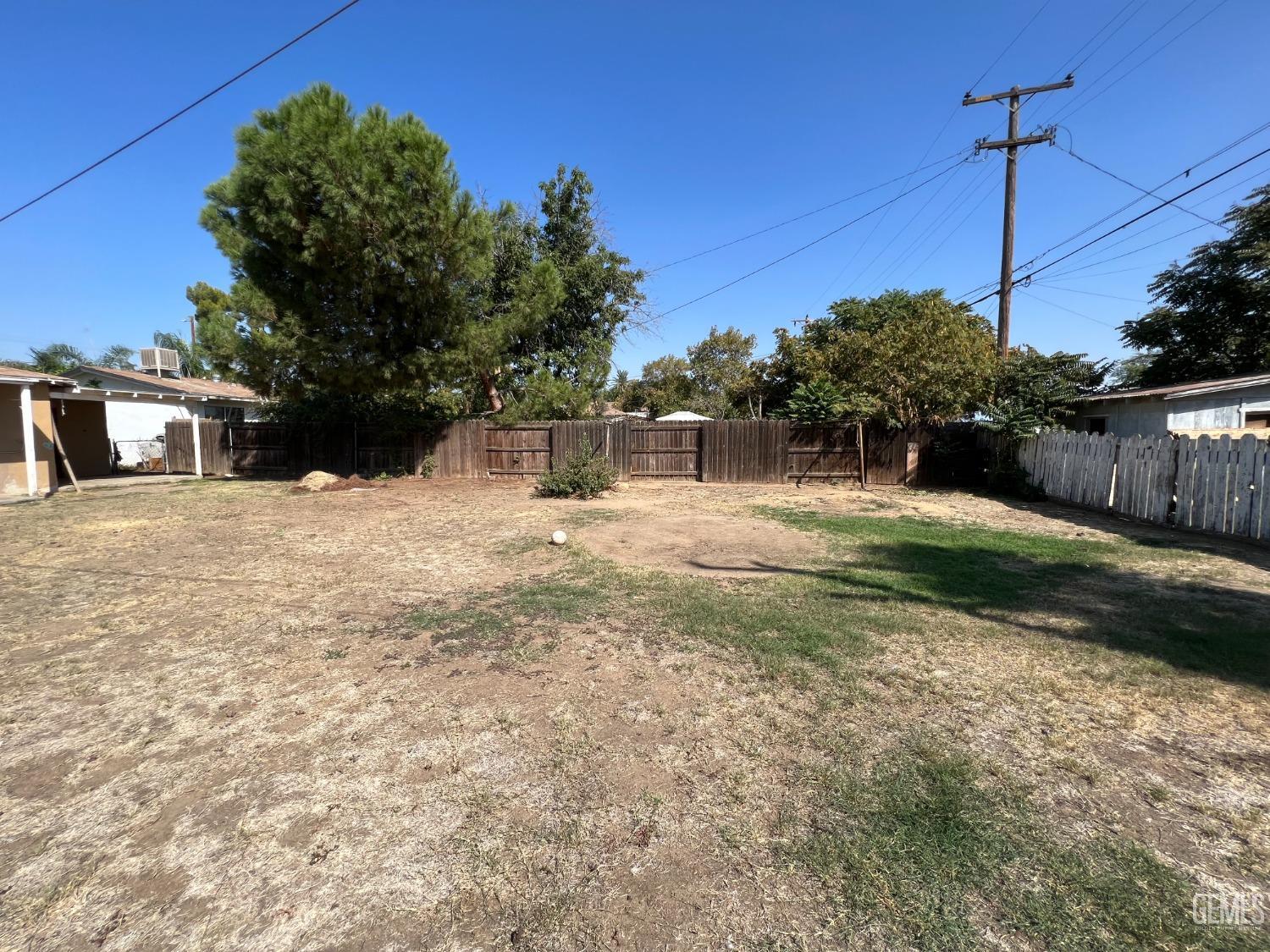 Undisclosed Address Bakersfield, CA 93306 - Photo 26 of 33 a backyard of a house with large trees