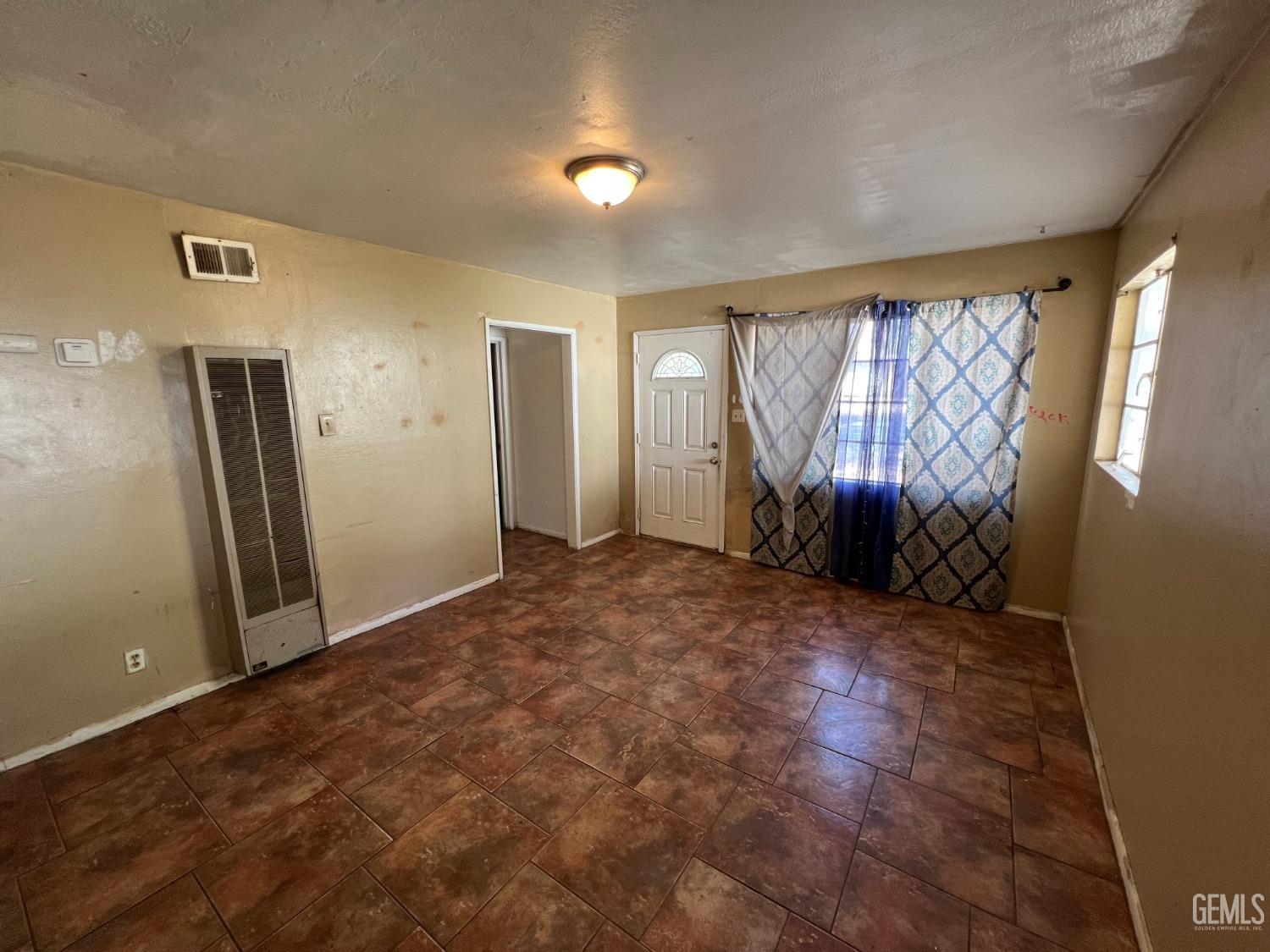 Undisclosed Address Bakersfield, CA 93306 - Photo 8 of 33 an empty room with windows