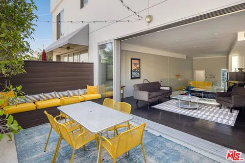 a view of swimming pool with seating area