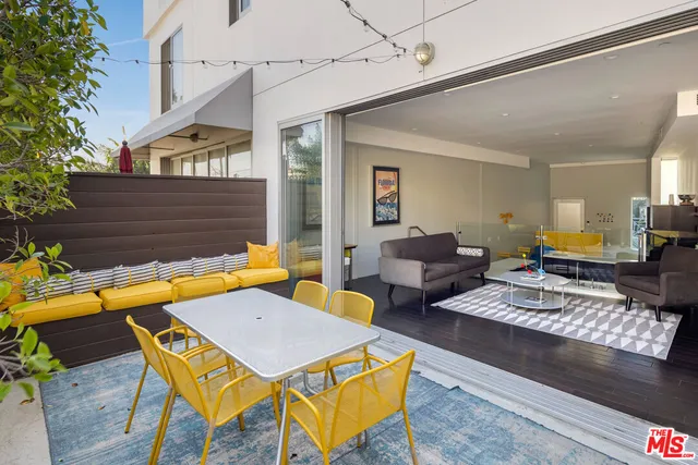 a view of swimming pool with seating area