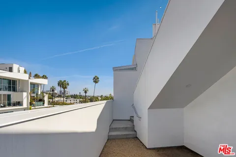 a view of a swimming pool and lounge chair
