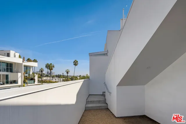 a view of a swimming pool and lounge chair