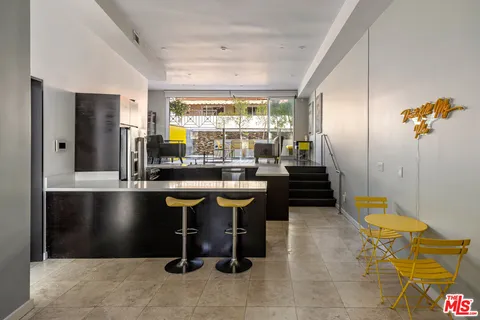 a room with gym equipment and a table